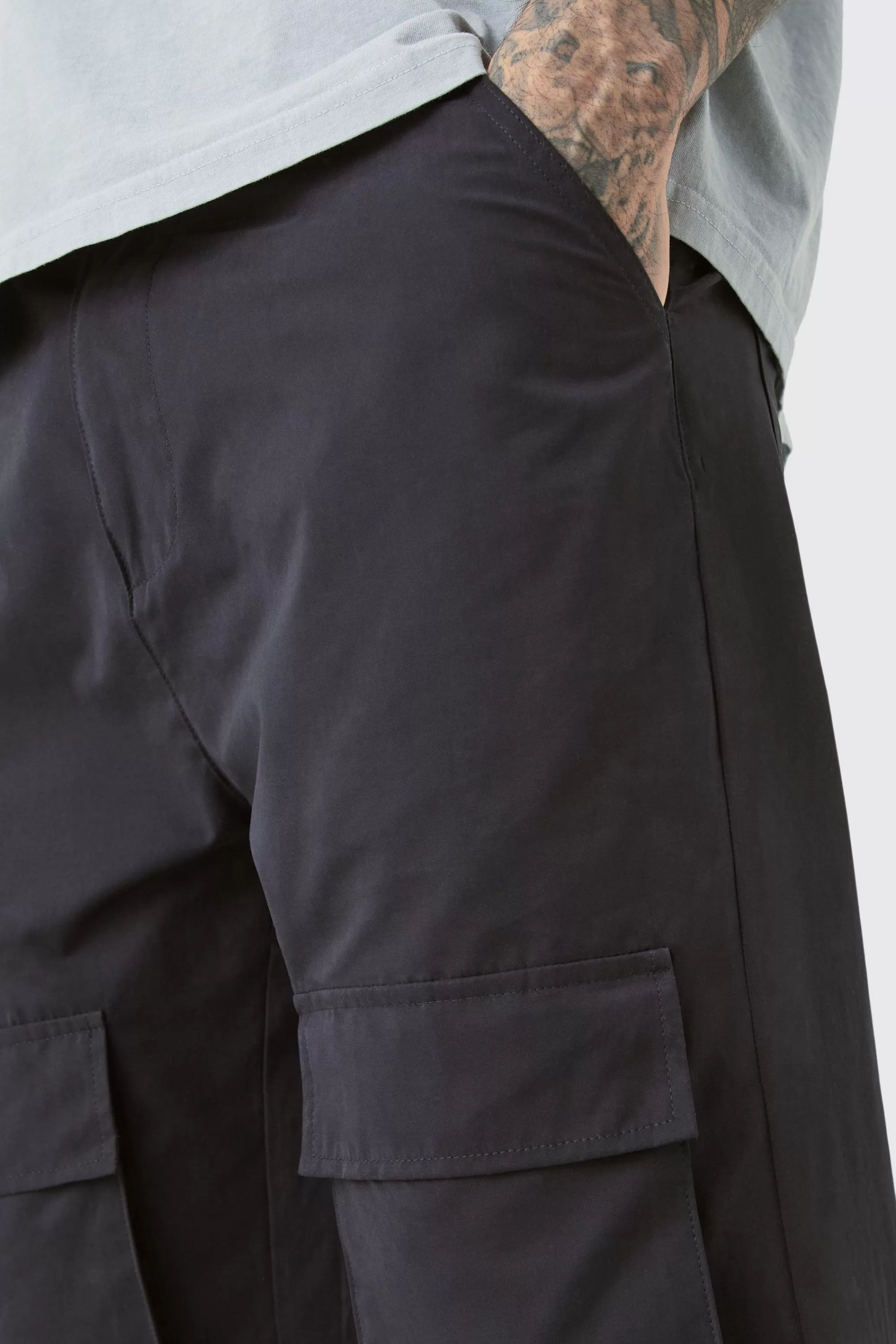 boohooMAN Tall Fixed Waist Relaxed Peached Flare Cargo Trouser | UK