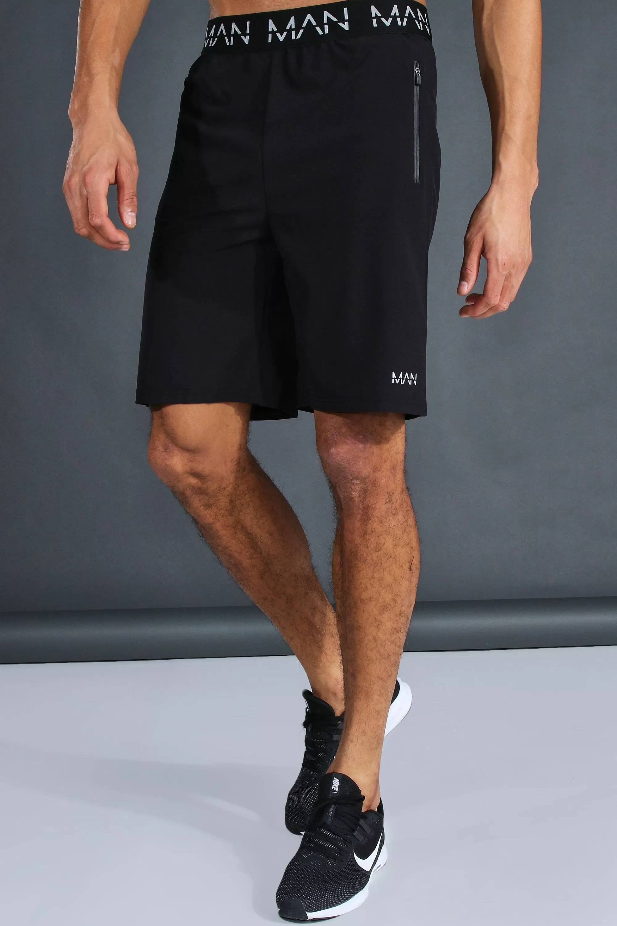 boohooMAN Tall Man Active Gym Zip Pocket Regular Fit 9inch Shorts | UK