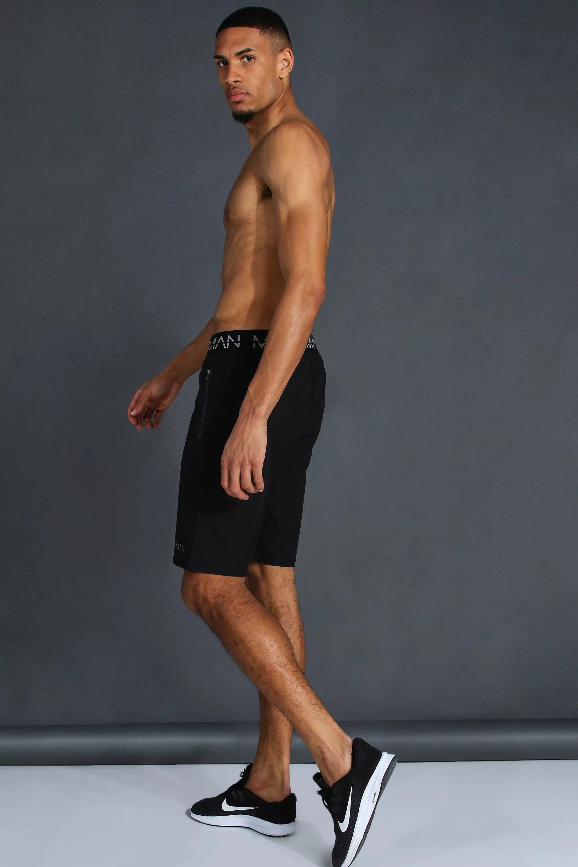 boohooMAN Tall Man Active Gym Zip Pocket Regular Fit 9inch Shorts | UK