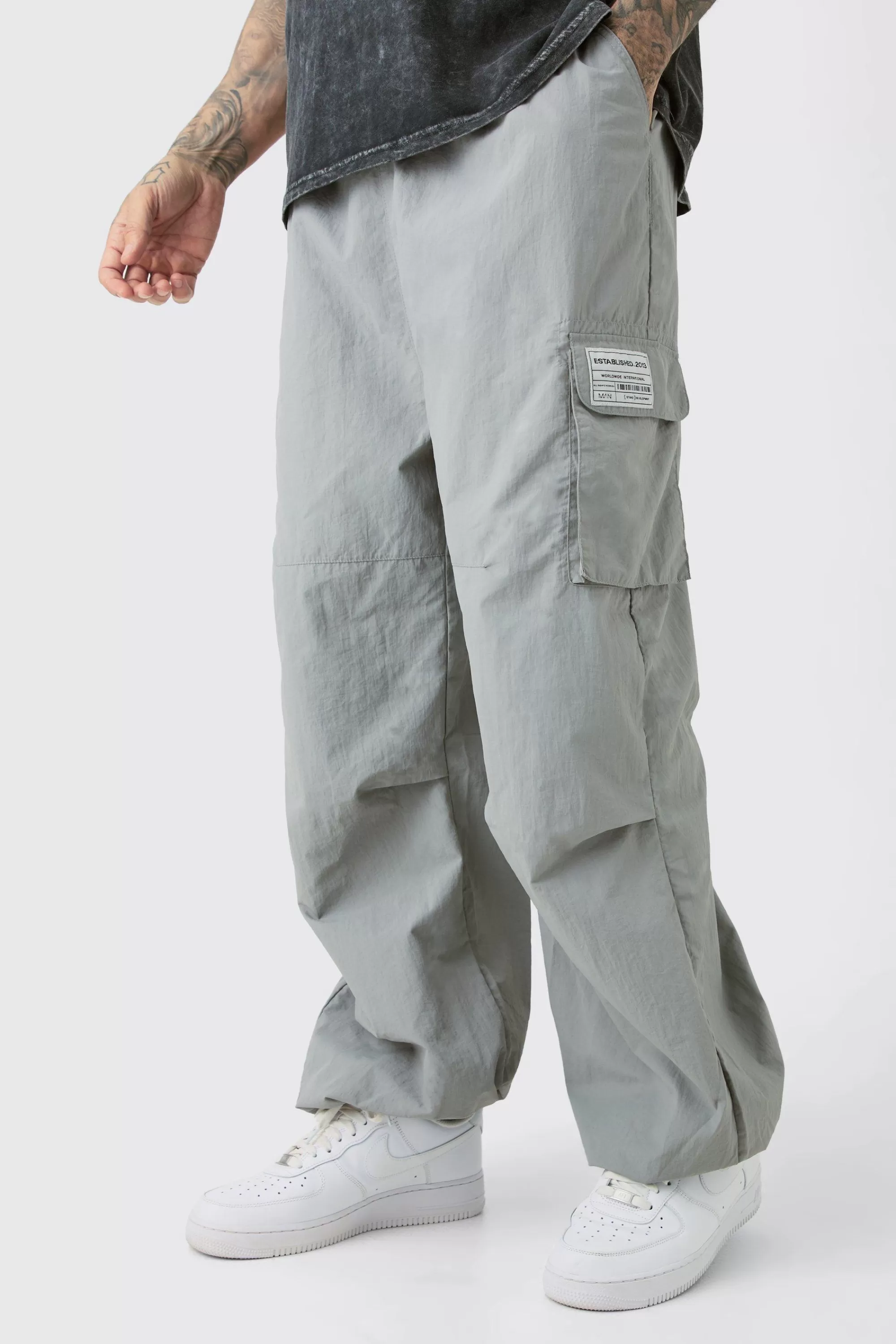 boohooMAN Tall Pleat Knee Branded Parachute Pants | UK