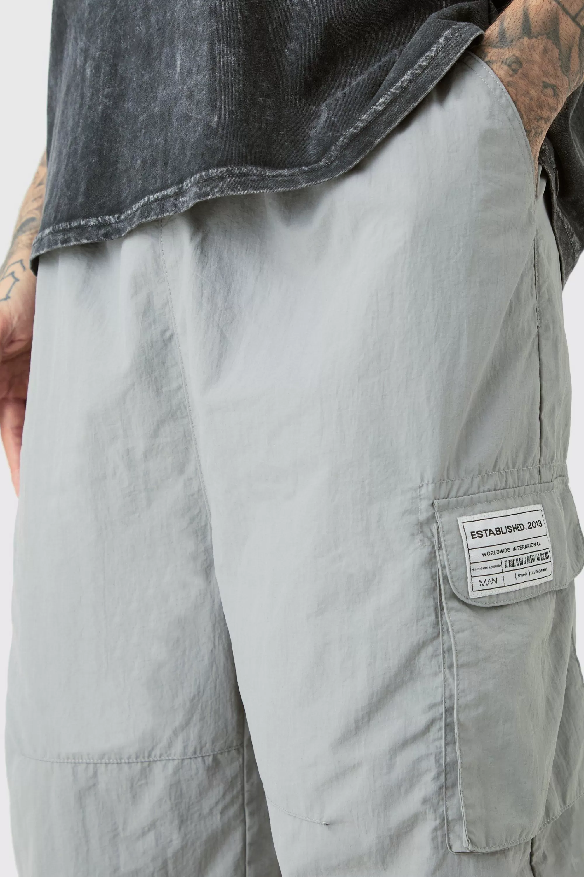 boohooMAN Tall Pleat Knee Branded Parachute Pants | UK