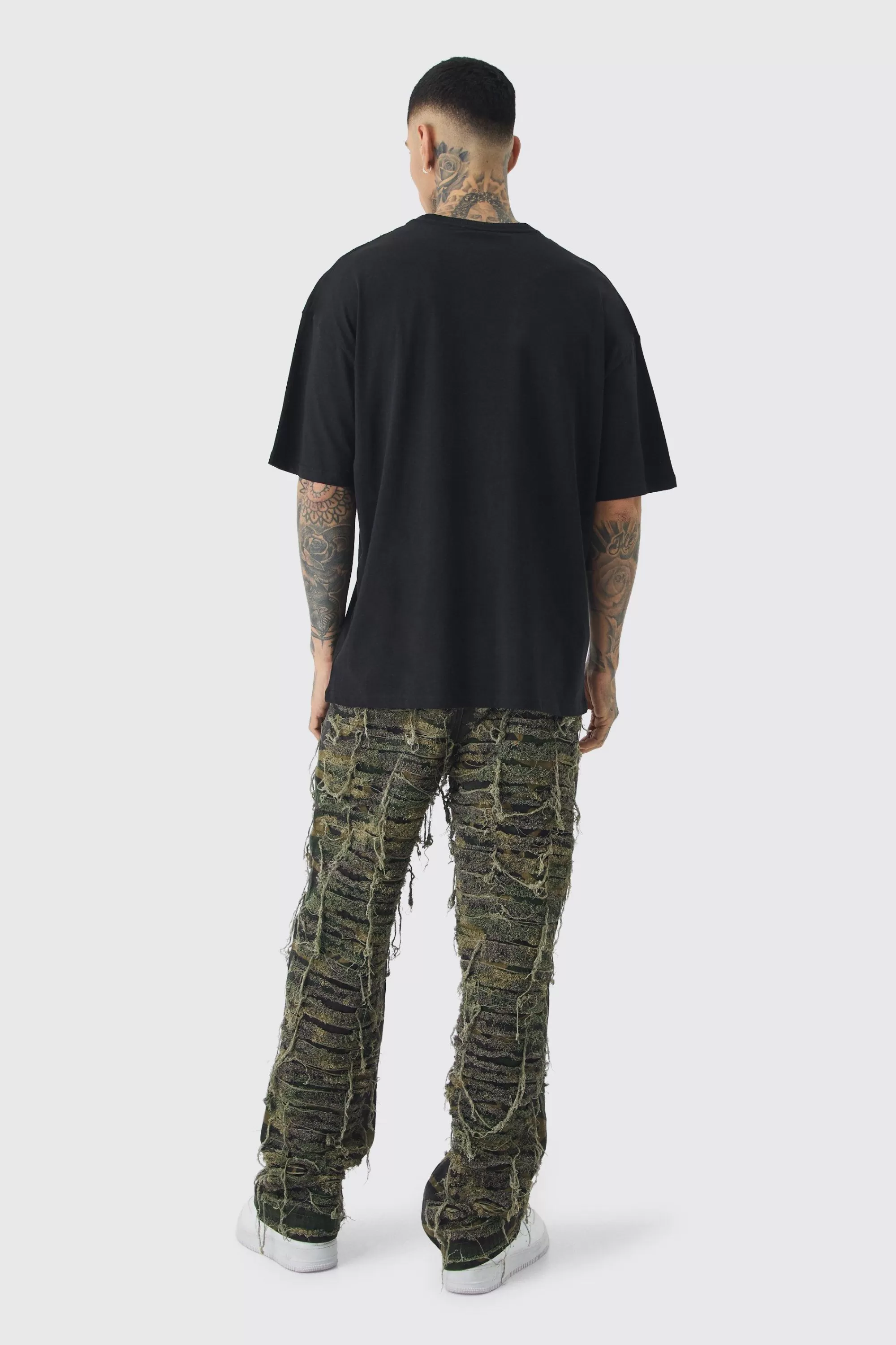 boohooMAN Tall Relaxed Heavily Distressed Camo Trouser | UK