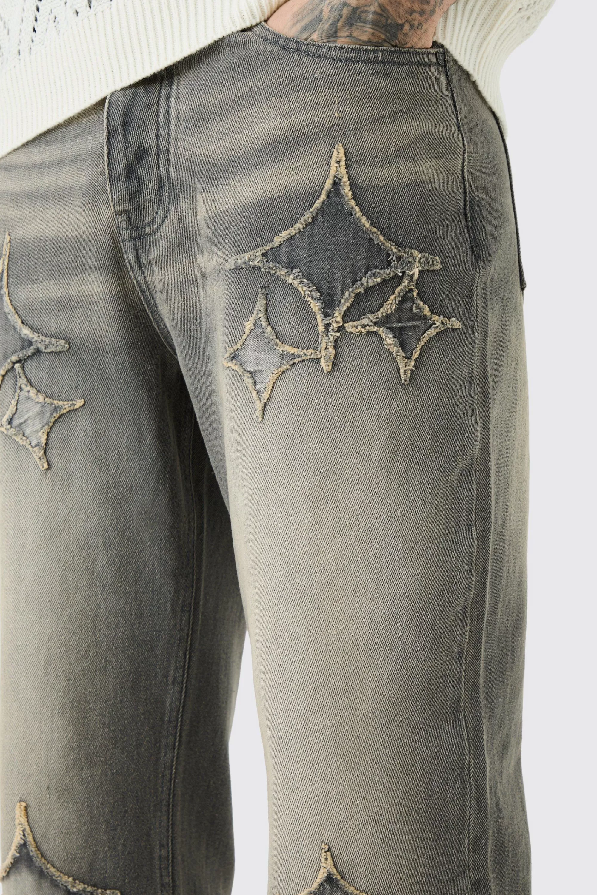 boohooMAN Tall Relaxed Rigid Flare Self Fabric Applique Gusset Jeans | UK