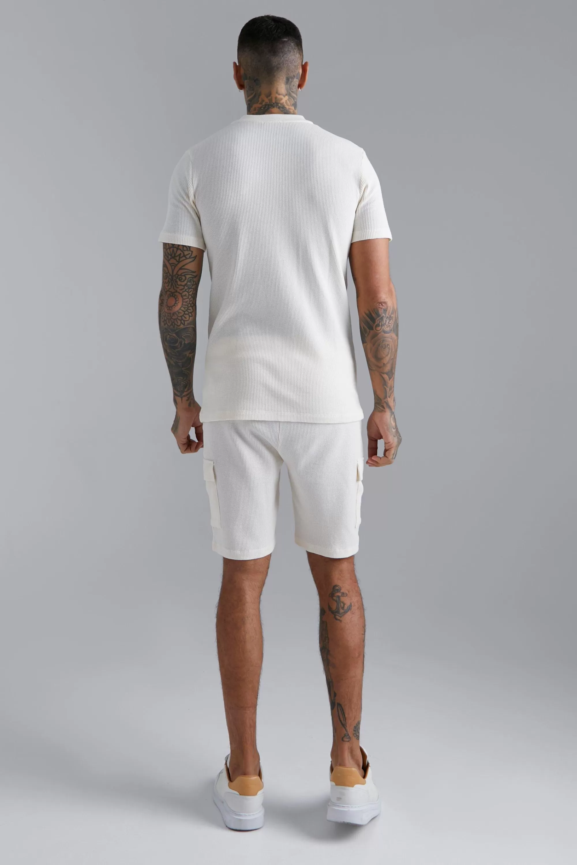 boohooMAN Waffle Bomber Neck 1/4 Zip Polo And Short Set | UK