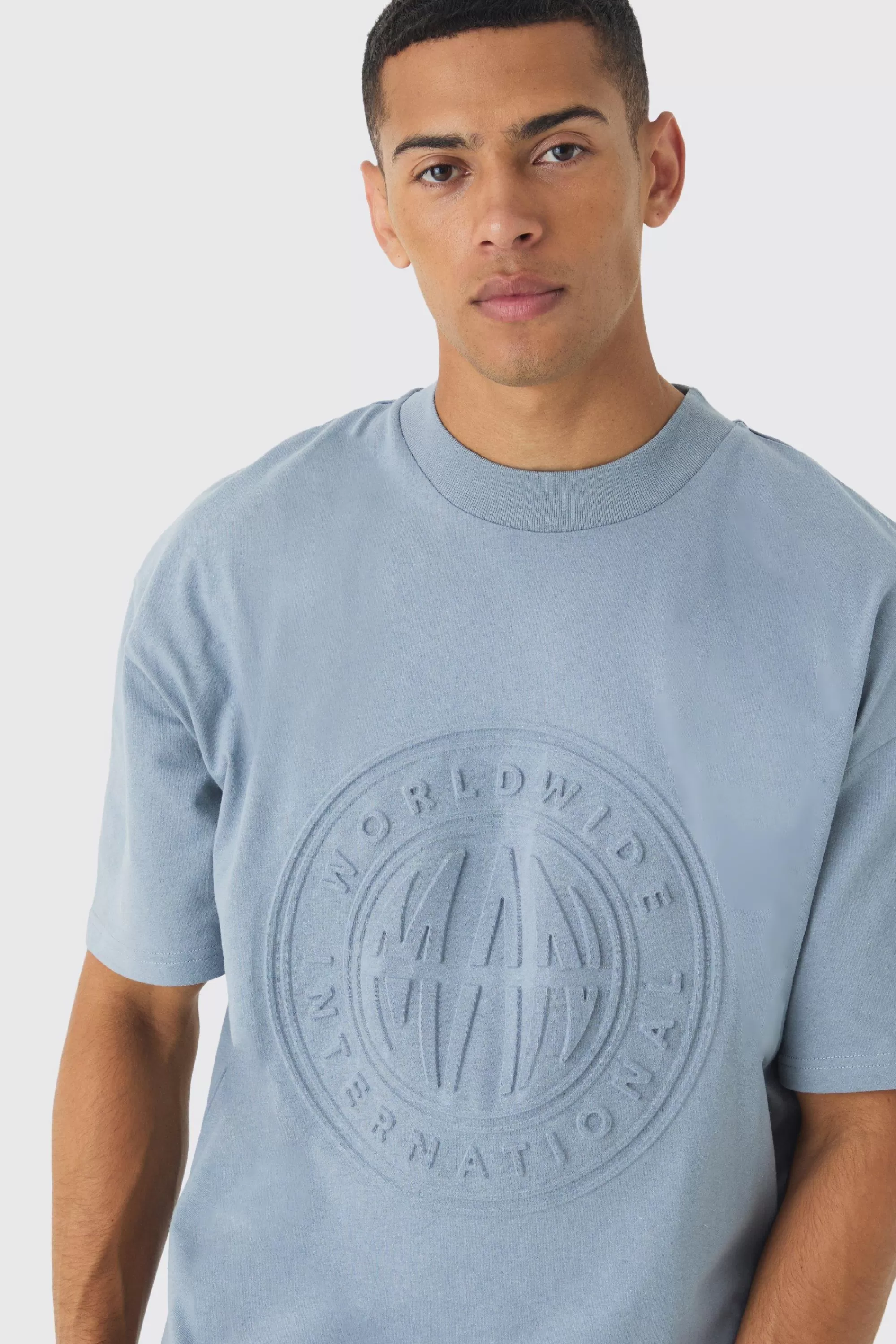 boohooMAN Oversized Extended Neck Worldwide Embossed T-Shirt | UK denim-blue New